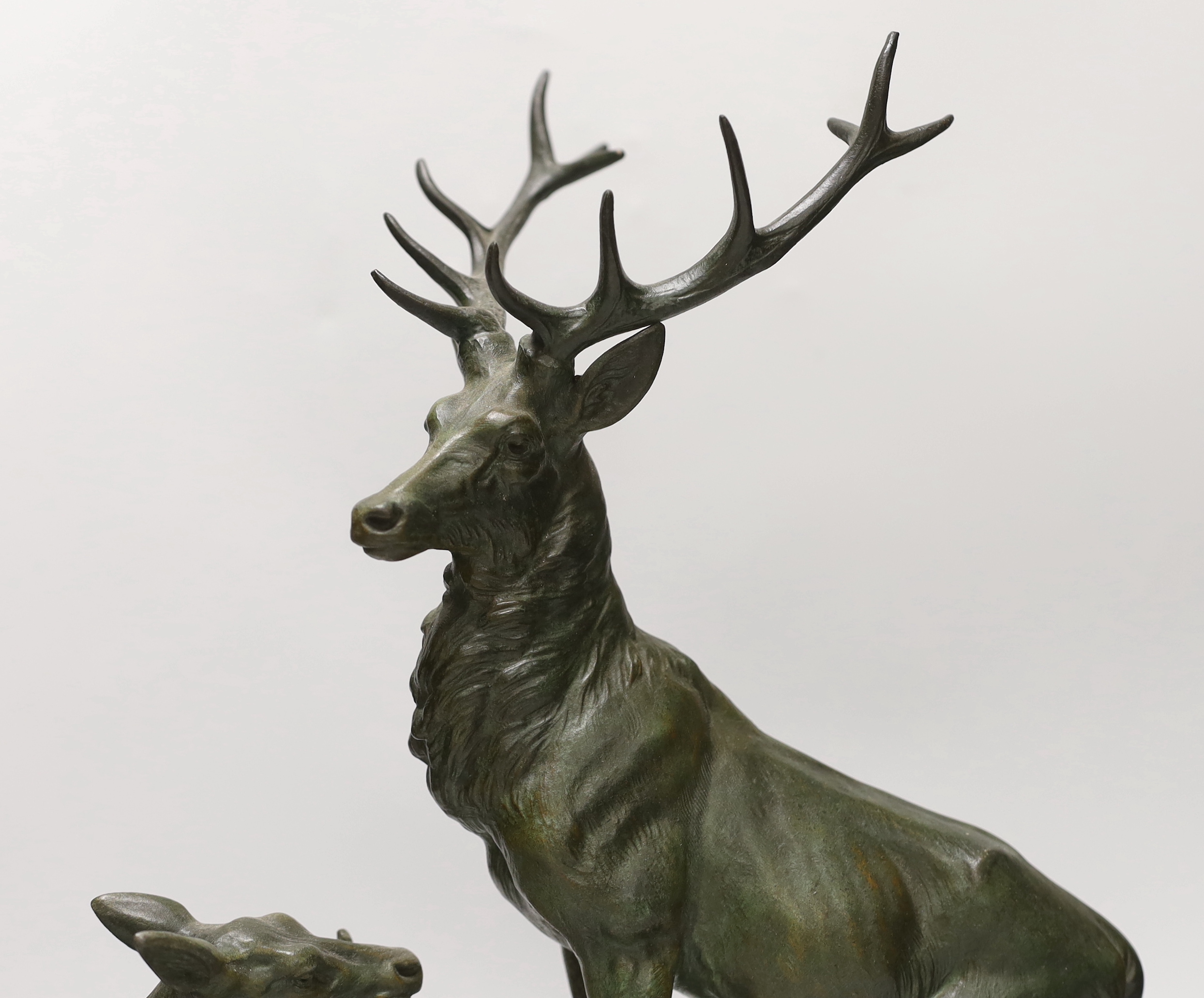 After Louis-Albert Carvin (1875–1951). A spelter group of a stag and faun, signed to base. 41cm tall